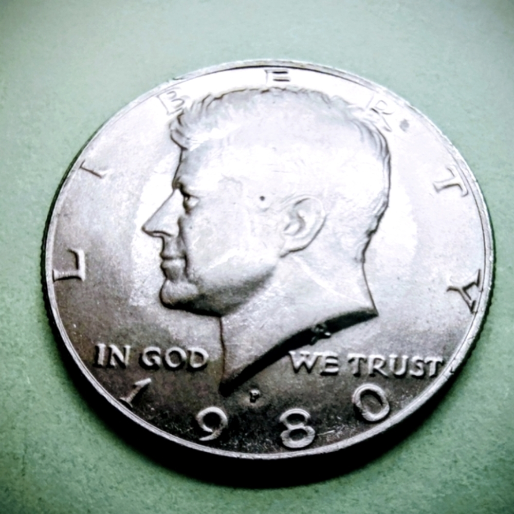 1980-P Kennedy Half Dollar Silver Toned Coin In Good Circulated Condition.